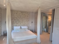 Bedroom looking through to en-suite bathroom.