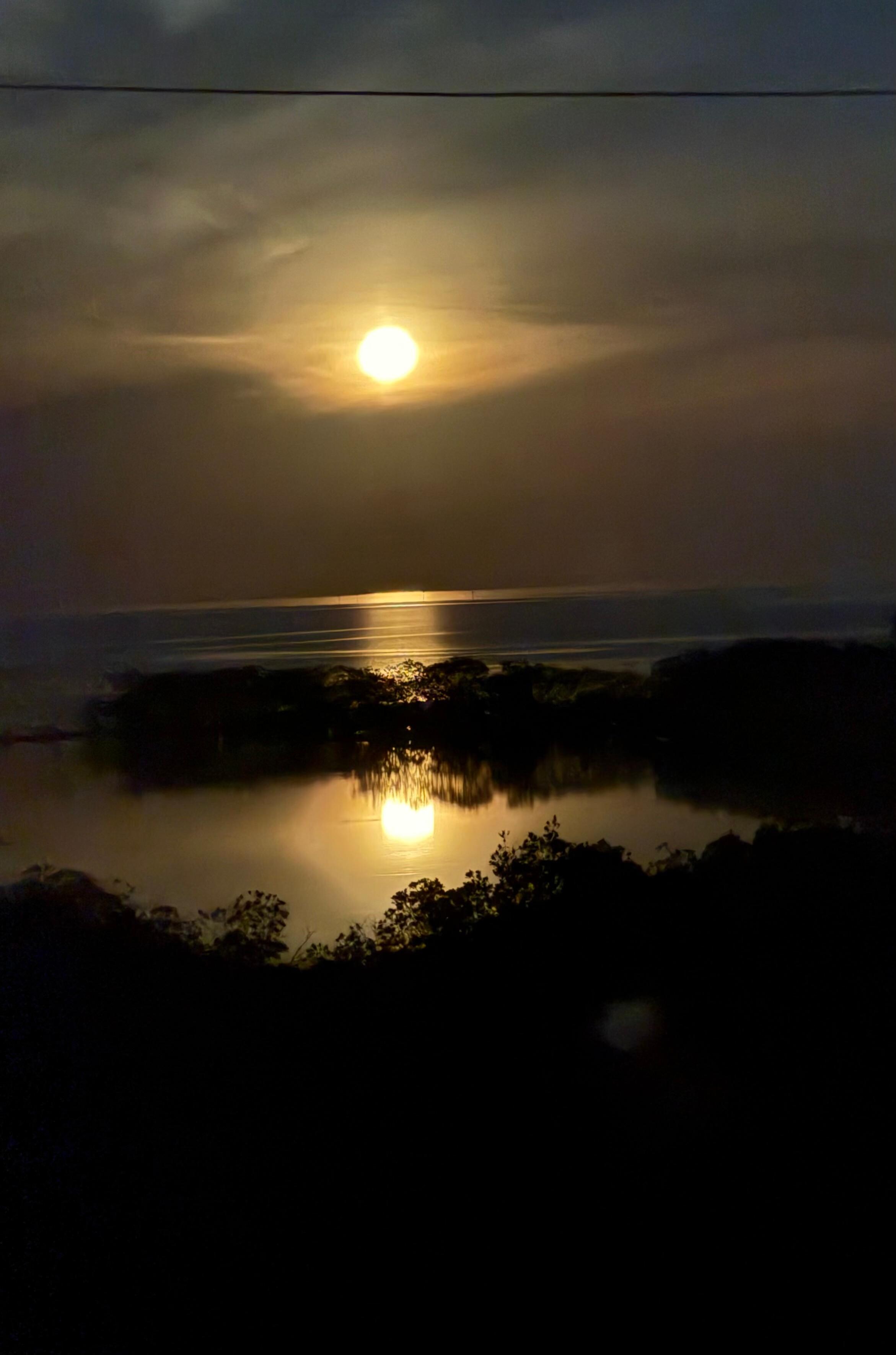 The view of the moon over the gulf.