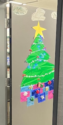 Holiday cheer leading into hotel workers' work space.