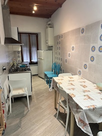Kitchen and only sitting area.