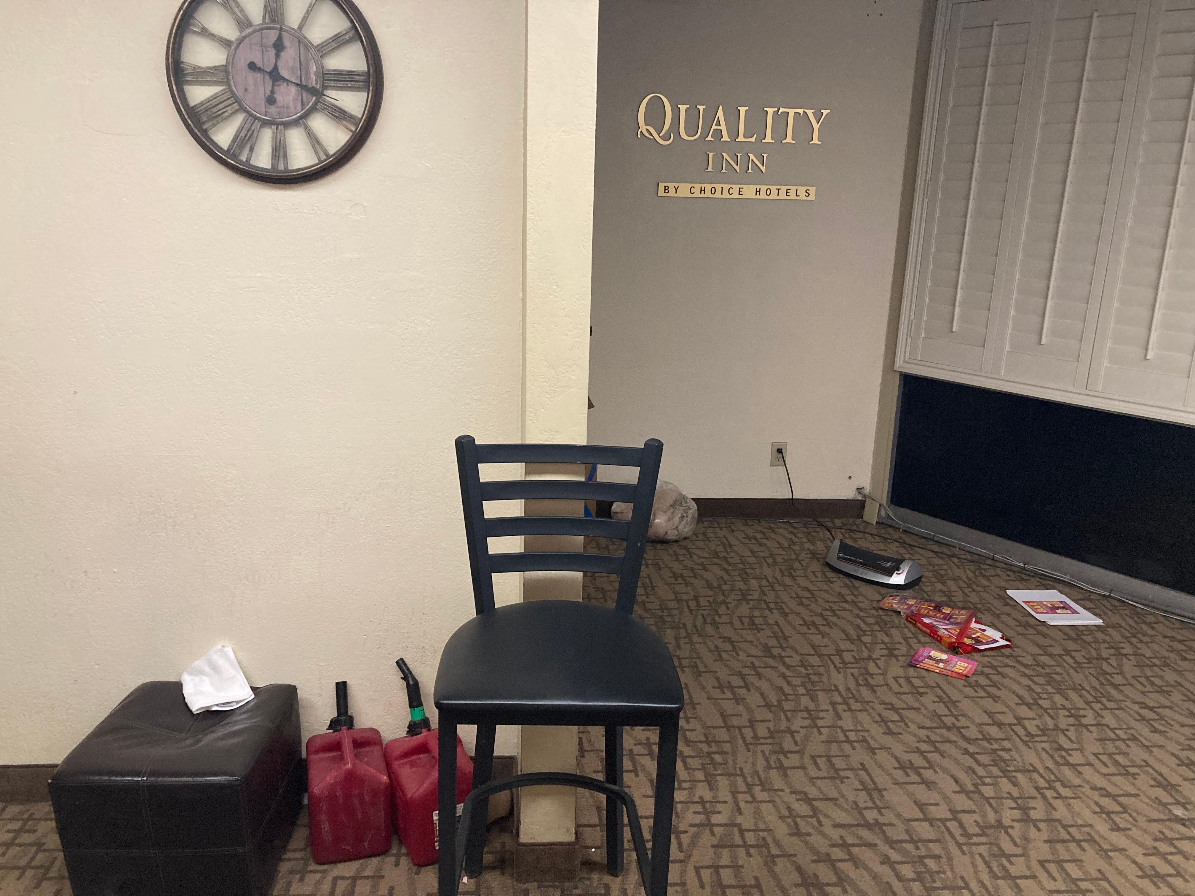 Gas cans stored in lobby is a fire code violation.