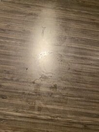 Coffee grounds and rings on the side table when we arrived