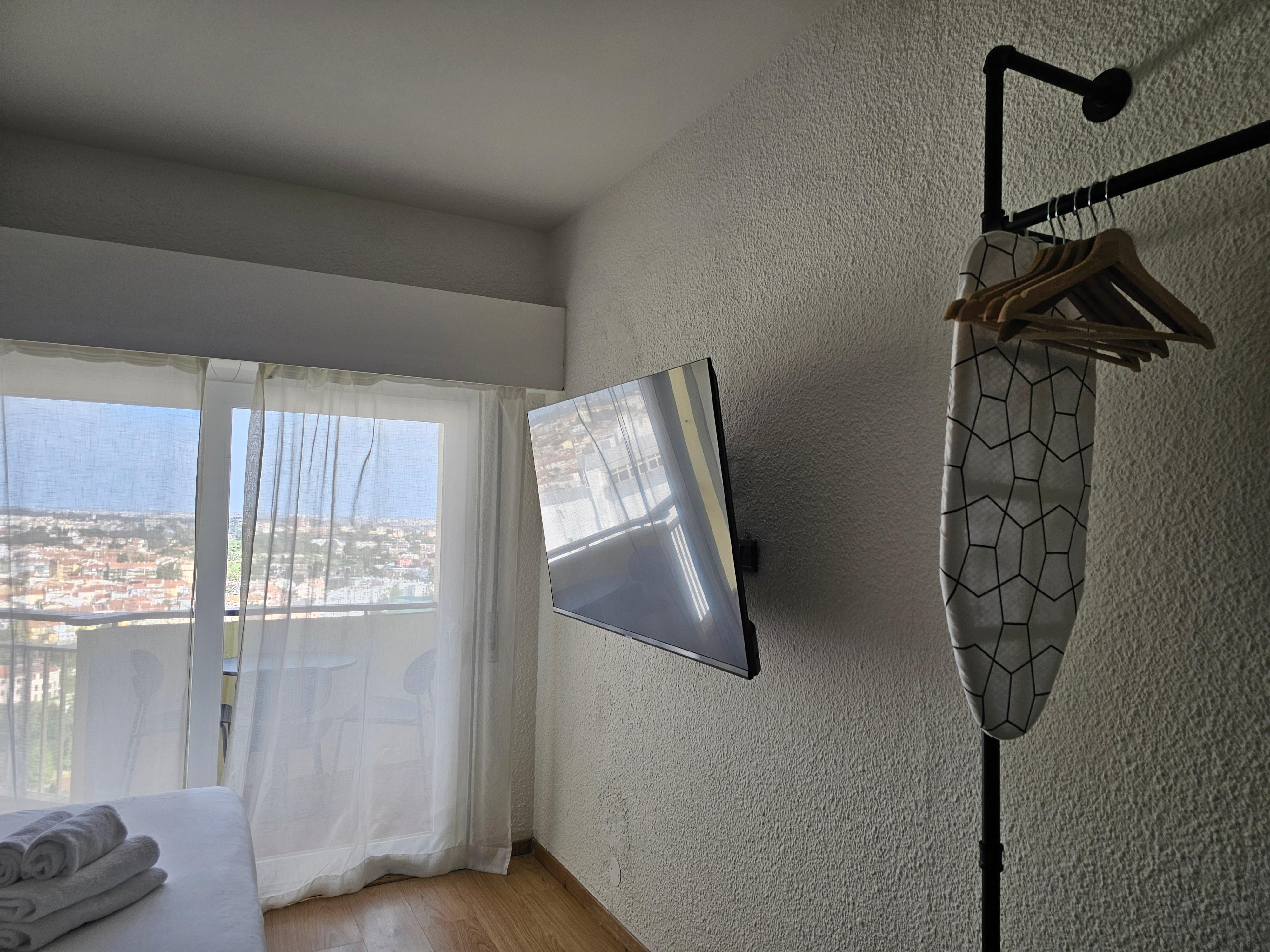 TV and lil ironing board 