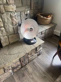 Personal heater in living room as substitute for main heater, which did not work on the main floor.