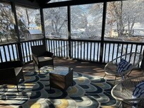 Beautiful screen-enclosed back porch.