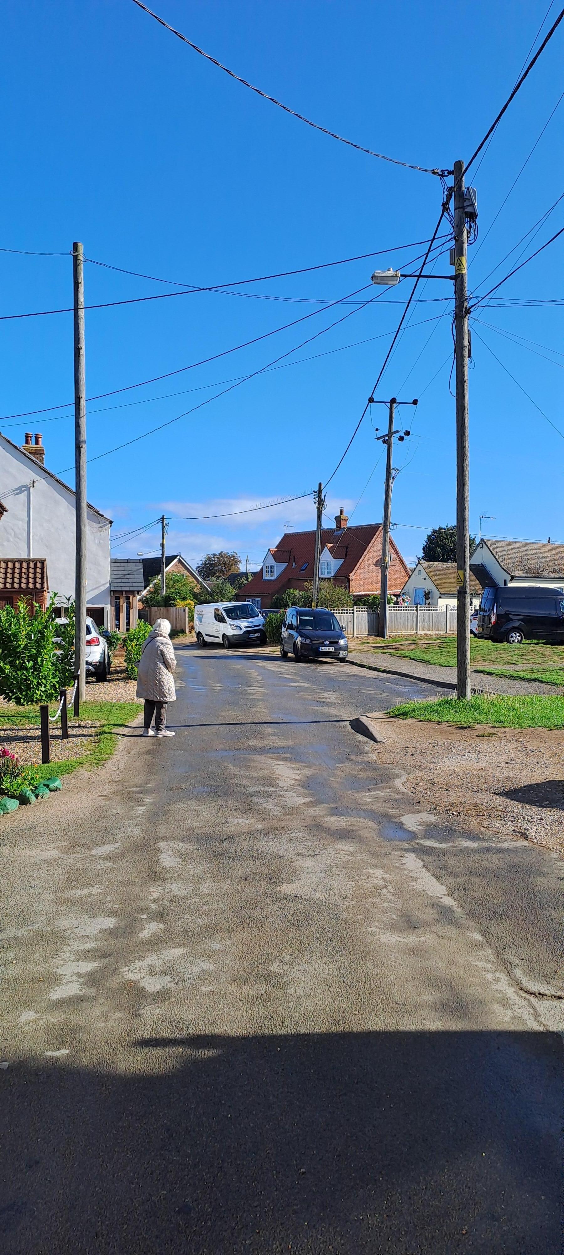 Methwold street showing electric service poles 