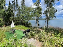 Small deck with grilling area closer to water.