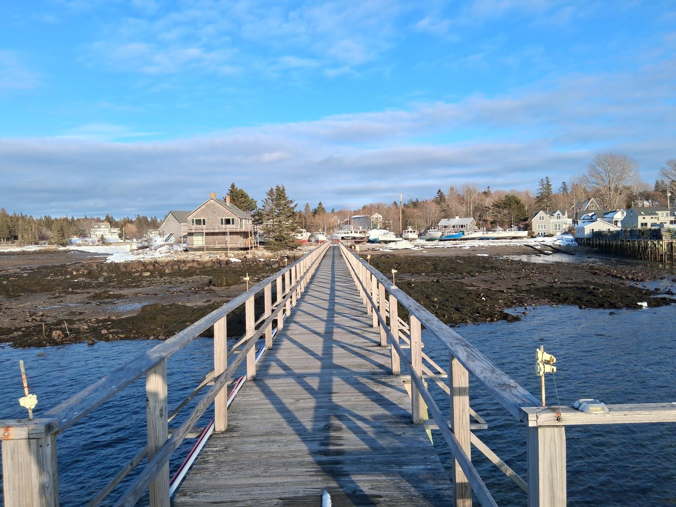 View of Mermaid Cottage (behind the blue boat) from the ferry dock.