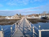 View of Mermaid Cottage (behind the blue boat) from the ferry dock.