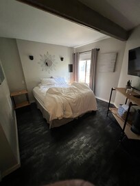 Unmade bed (sorry) in main bedroom.