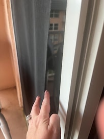 Ripped sliding screen door which we were unable to even use.