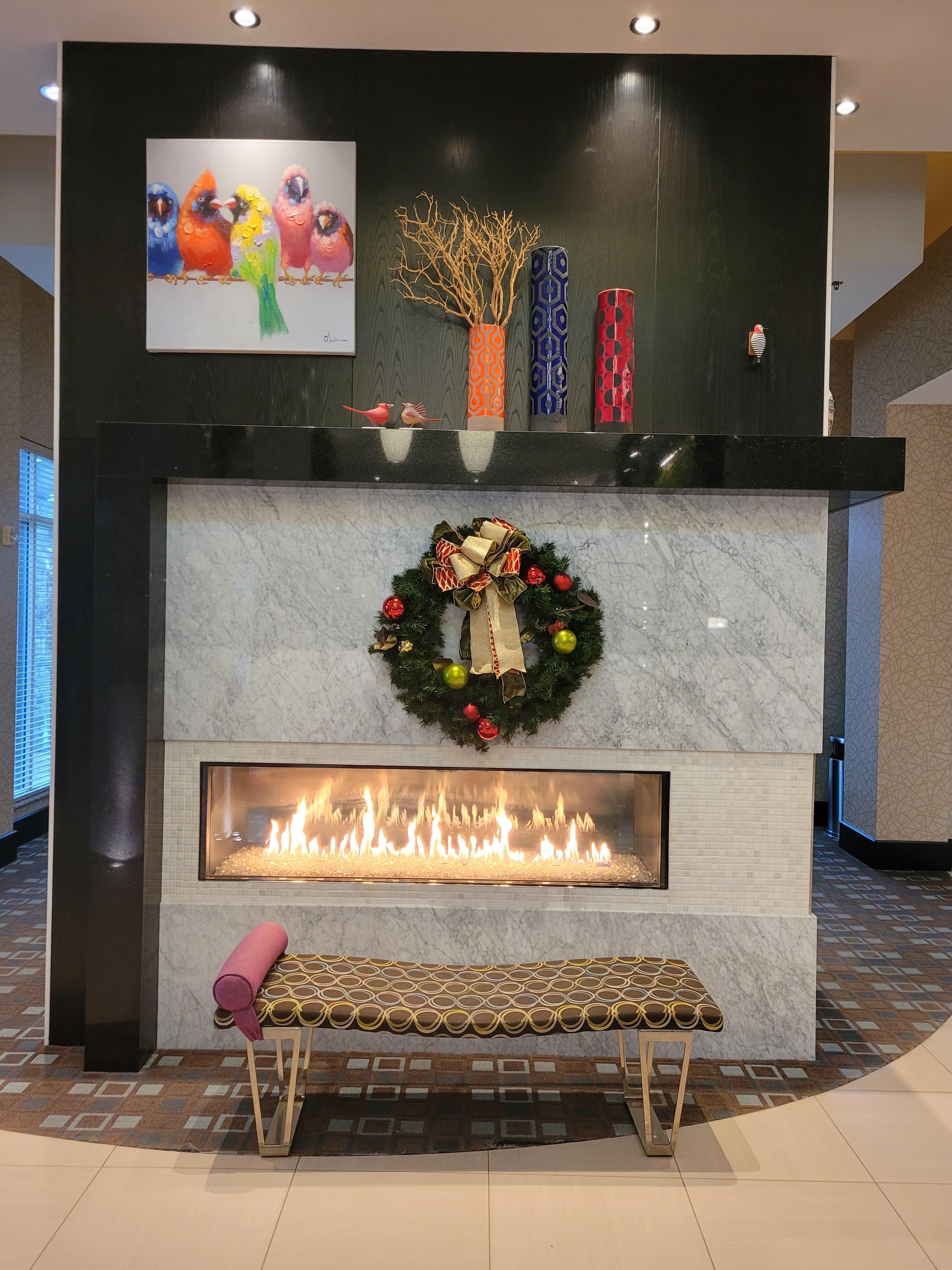 A warm fireplace & Christmas tree to set the holiday mood.