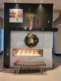 A warm fireplace & Christmas tree to set the holiday mood.