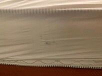 Footprint on side of mattress.