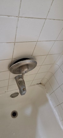 Shower control sticking out. Off the wall.
