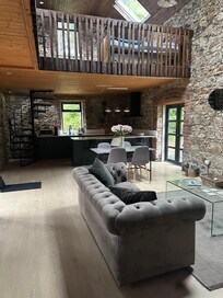 view from main floor looking towards kitchen and high ceilings