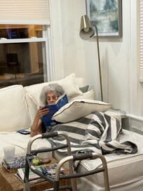 96 year old snuggling to read.