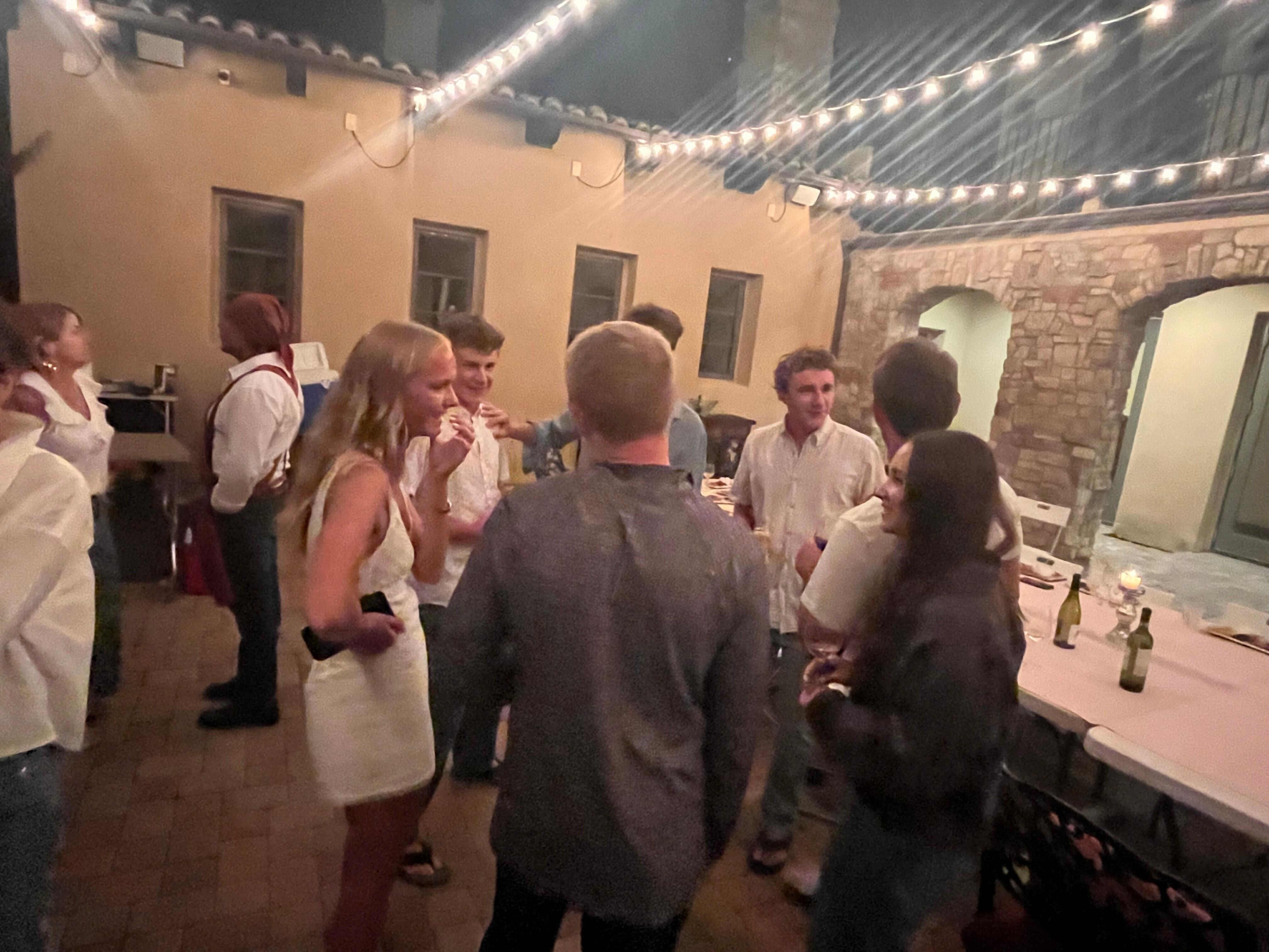 The patio has beautiful lighting for evening dinners.