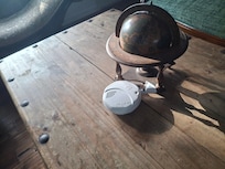 Smoke alarm not installed sitting on the living room table.