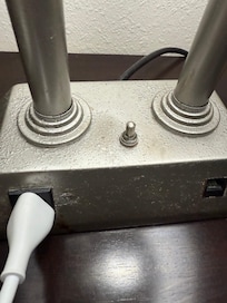 The metal fixtures are rusted and painted over.