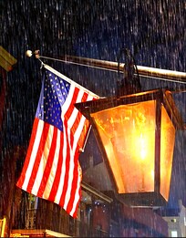 Front view of the gas lanterns and flag during rain