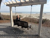 Porch swings overlook the beach