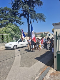 Watching Bastille Day, July 14th parade outside gate