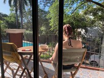 Patio overlooking the pool in the complex