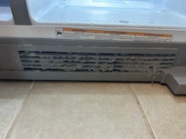 Bottom of fridge. The inside of the fridge is also dirty (no picture available)
