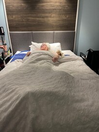 My mother in the comfy bed . Lots of room to get her in and out !!