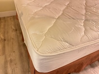 Ripped protective cover on the bed providing no protection from previous guests or bugs imbedded