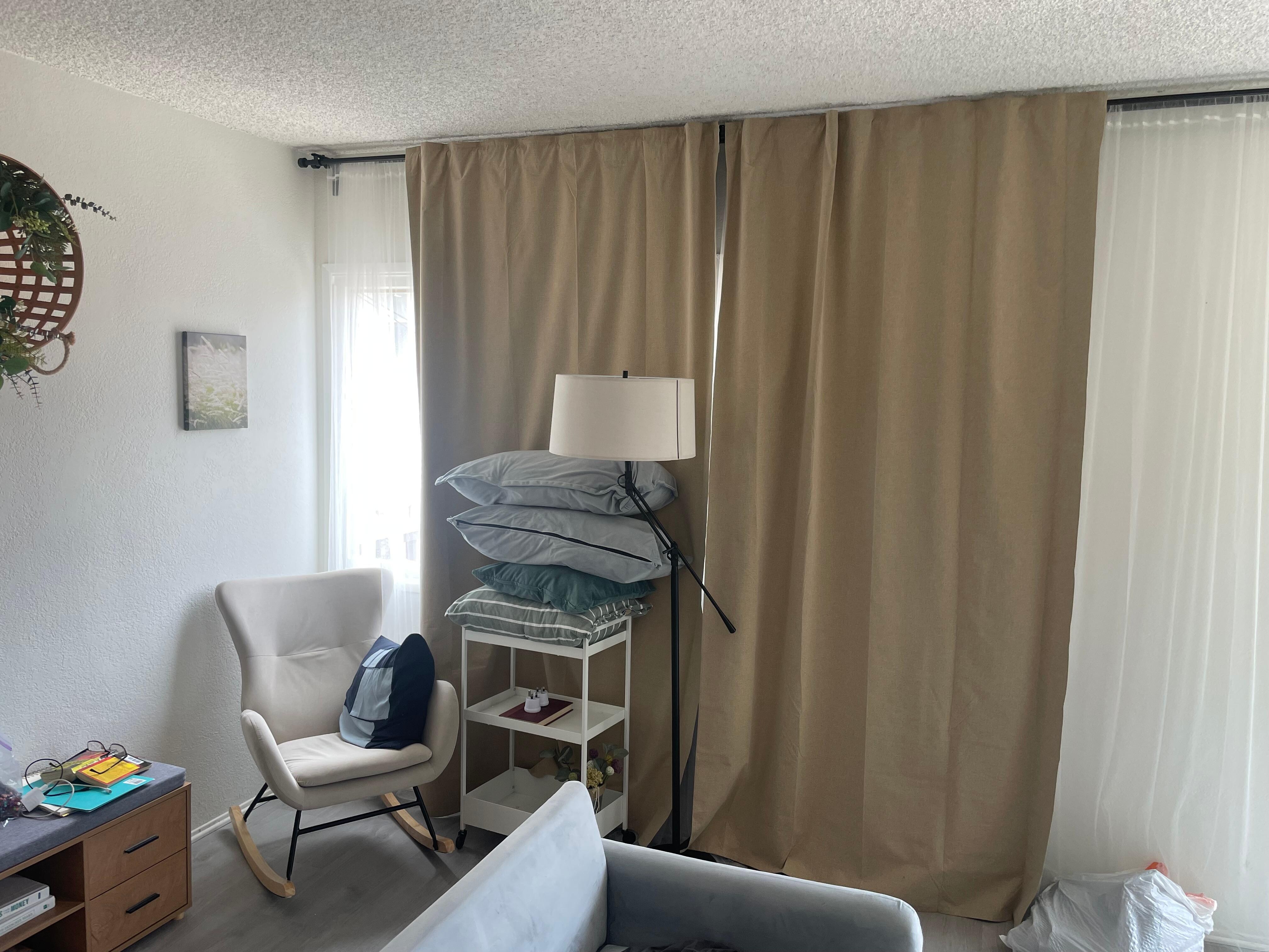 Darker curtain does not cover entire window so sunlight comes in in the morning.