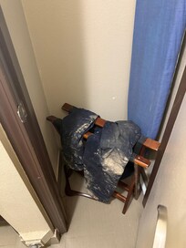 Dirty pants in the closet.