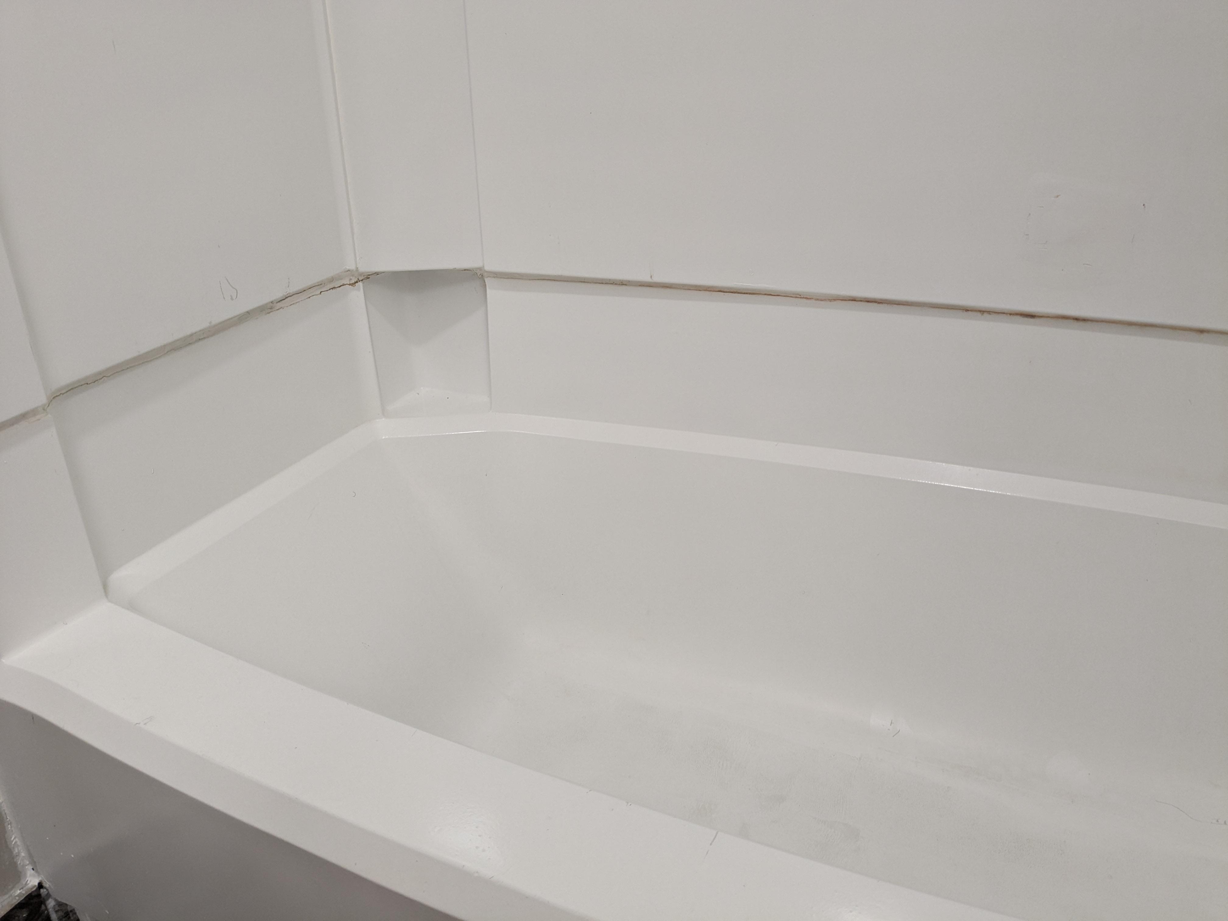 Tub is stained and cracking under that benter edge.