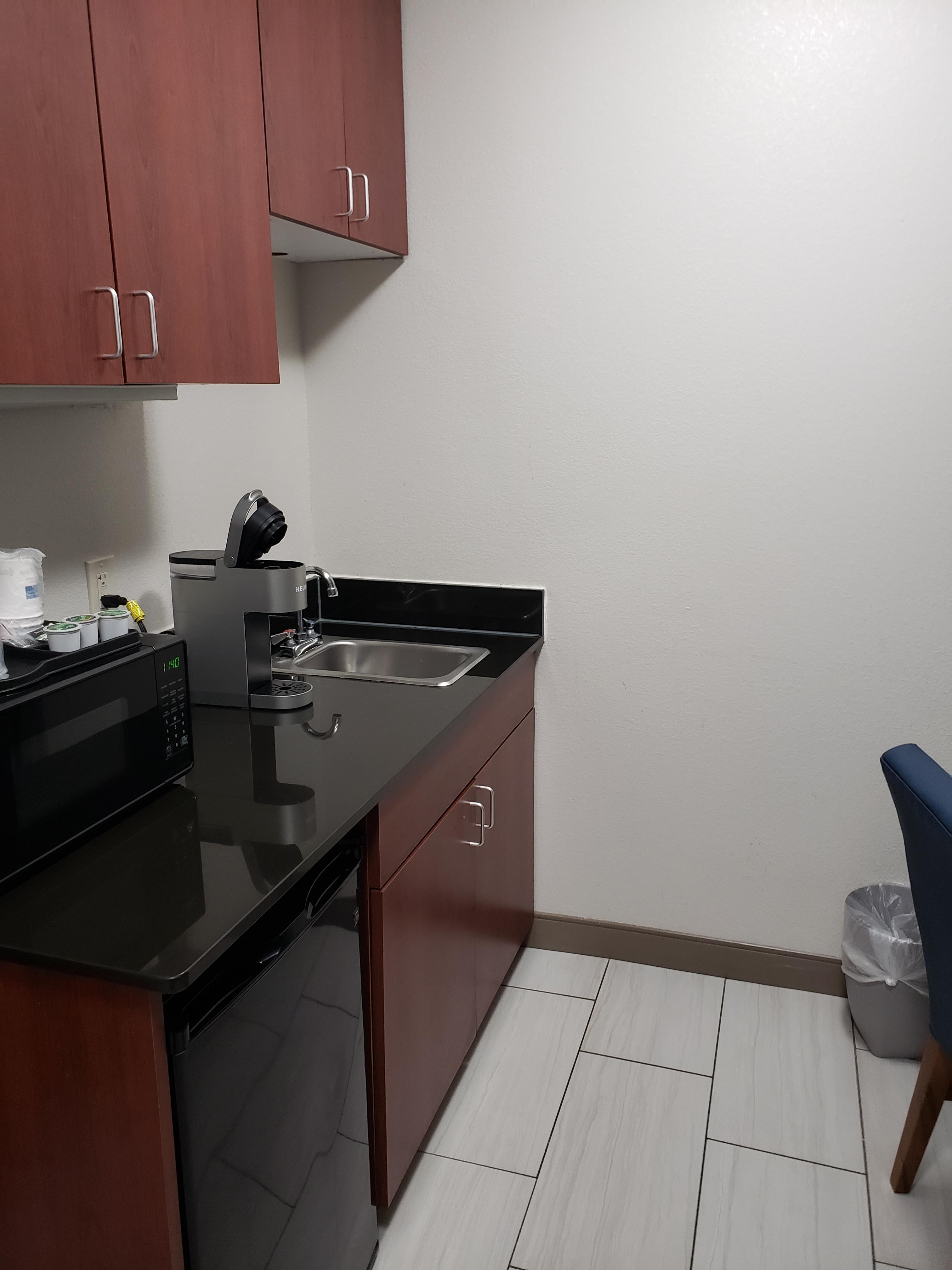 Kitchenette.  Microwave, fridge, sink. No towels or dishes though
