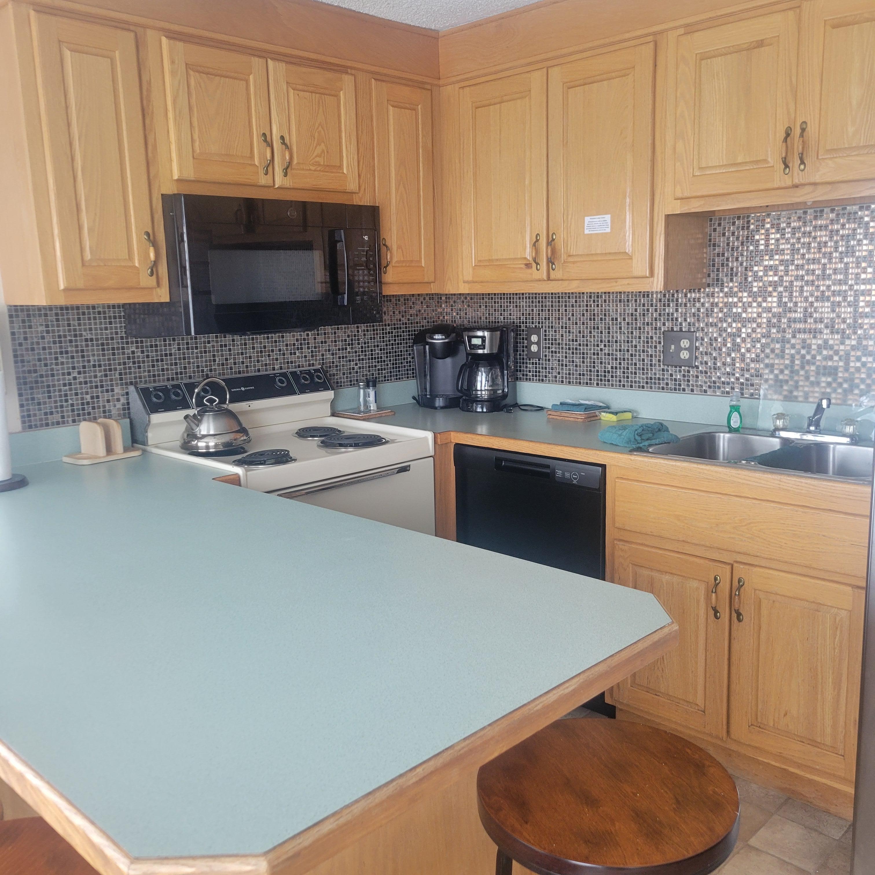 Well equipped clean kitchen.  Lot of working room on the island.