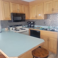 Well equipped clean kitchen. Lot of working room on the island.