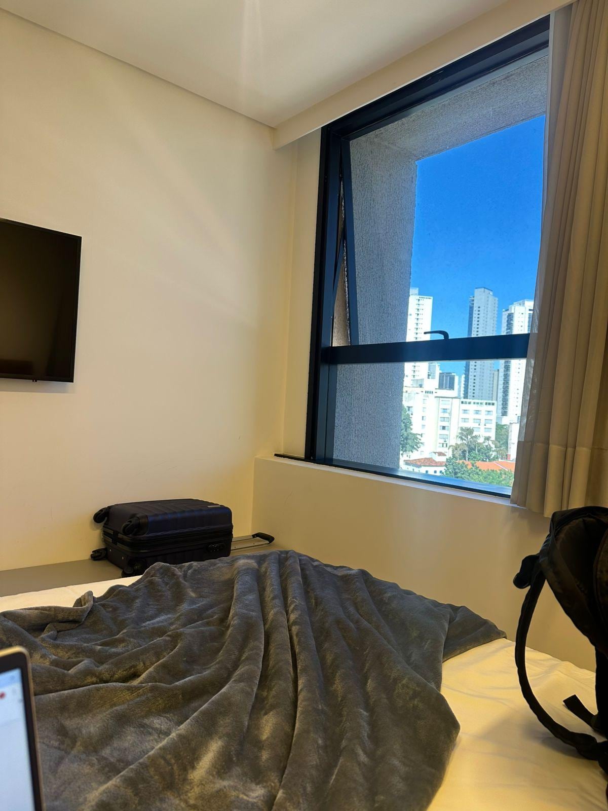 Visão da cama e de Goiânia