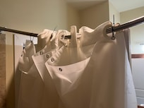 Zip ties to hold up the pitiful shower curtain.
