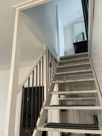 The railing half way up the staircase