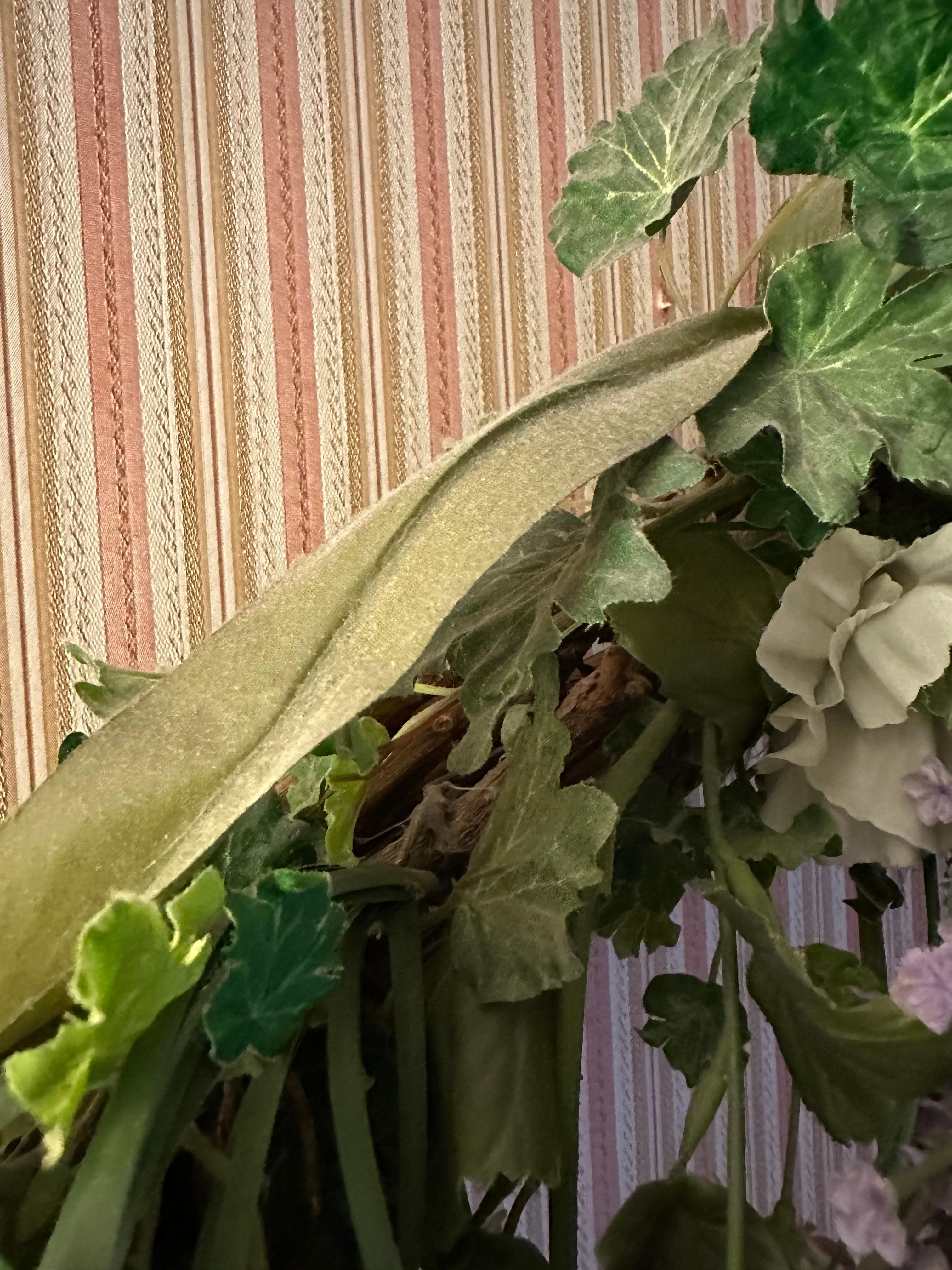 Dusty artificial flower arrangements.