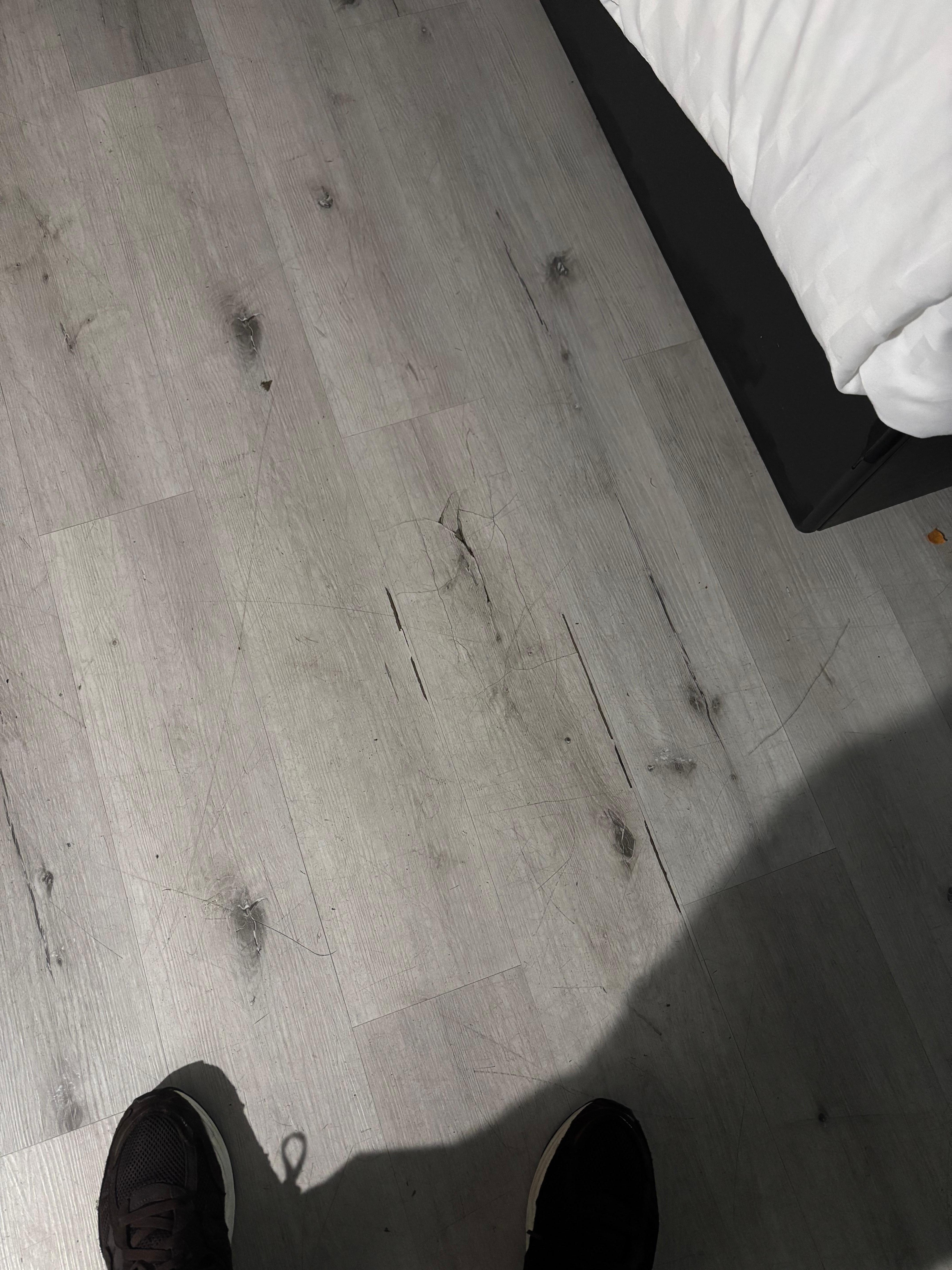 Cracked wood paneling that causes the floor around it to sink