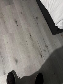 Cracked wood paneling that causes the floor around it to sink