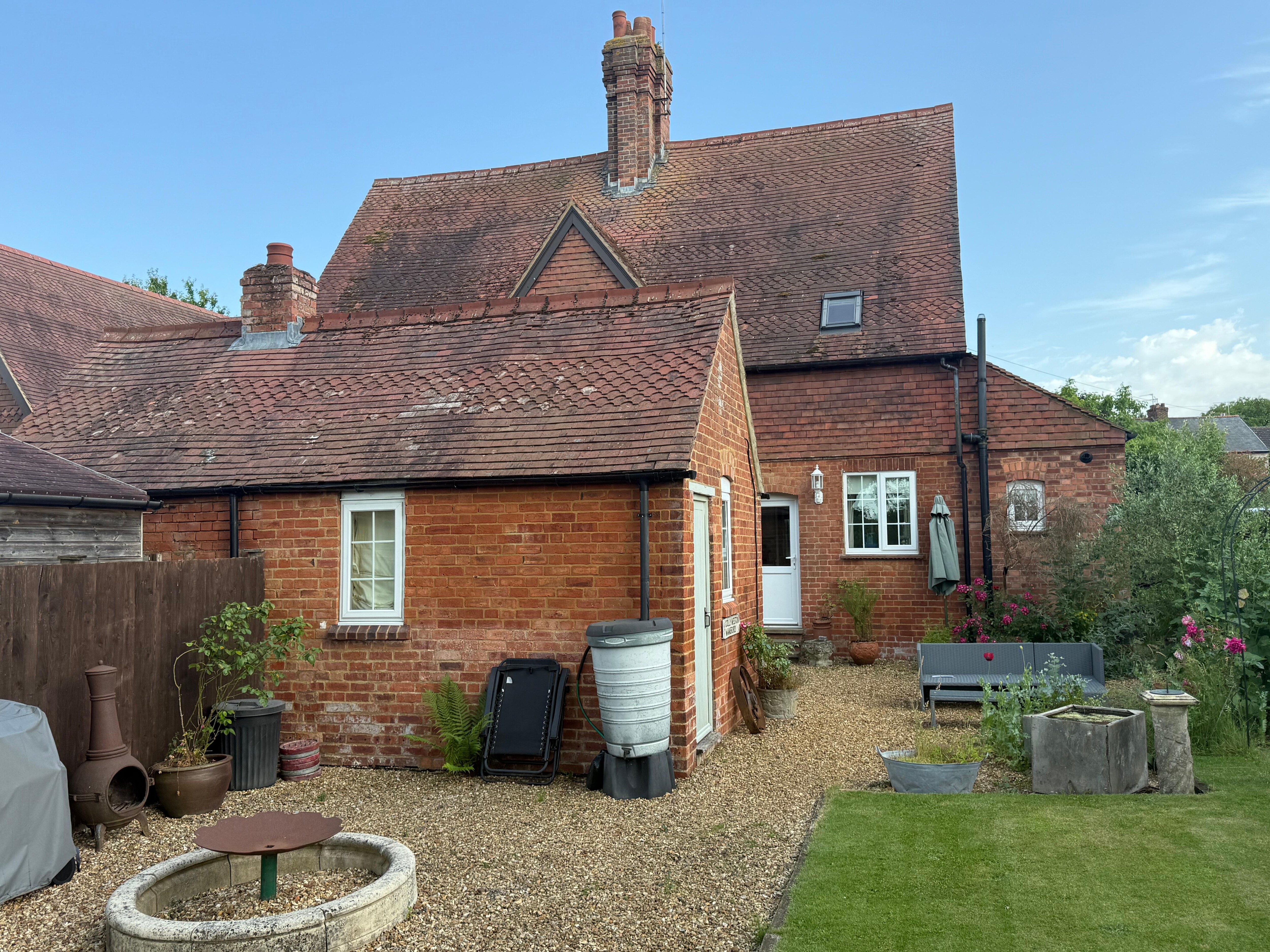 Back of the house beautifully landscaped and a nice sitting area