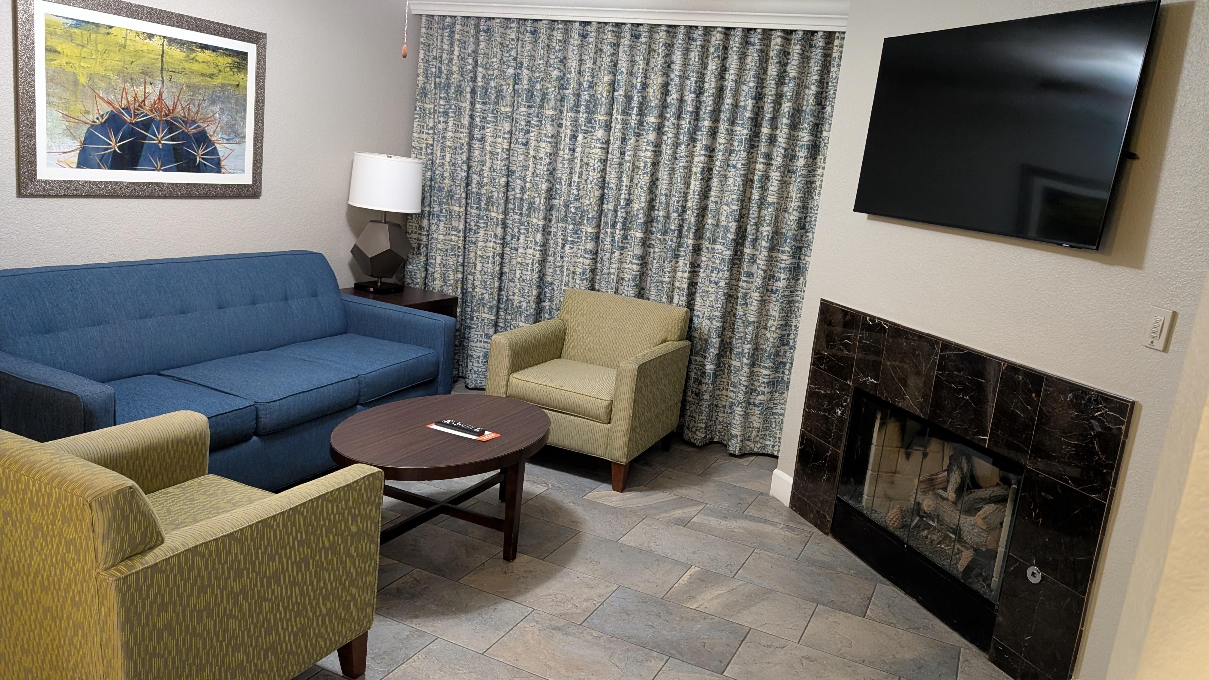 Living room with fireplace, behind the curtain is your personal patio