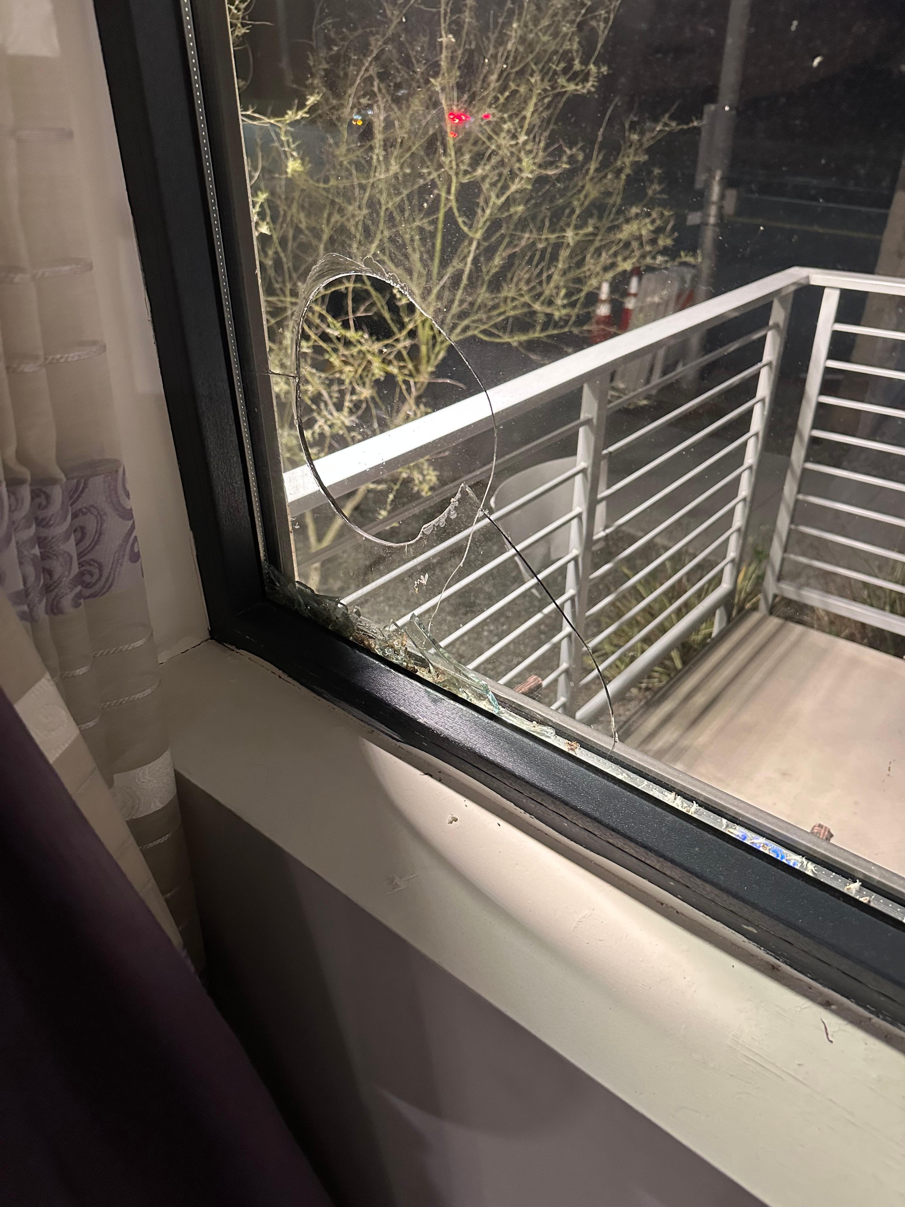 Head sized hole in one of the two panes of glass. 