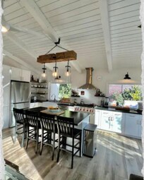 Soapstone counters, uniquely carved lighting fixtures, and cheery sunlight set the stage...