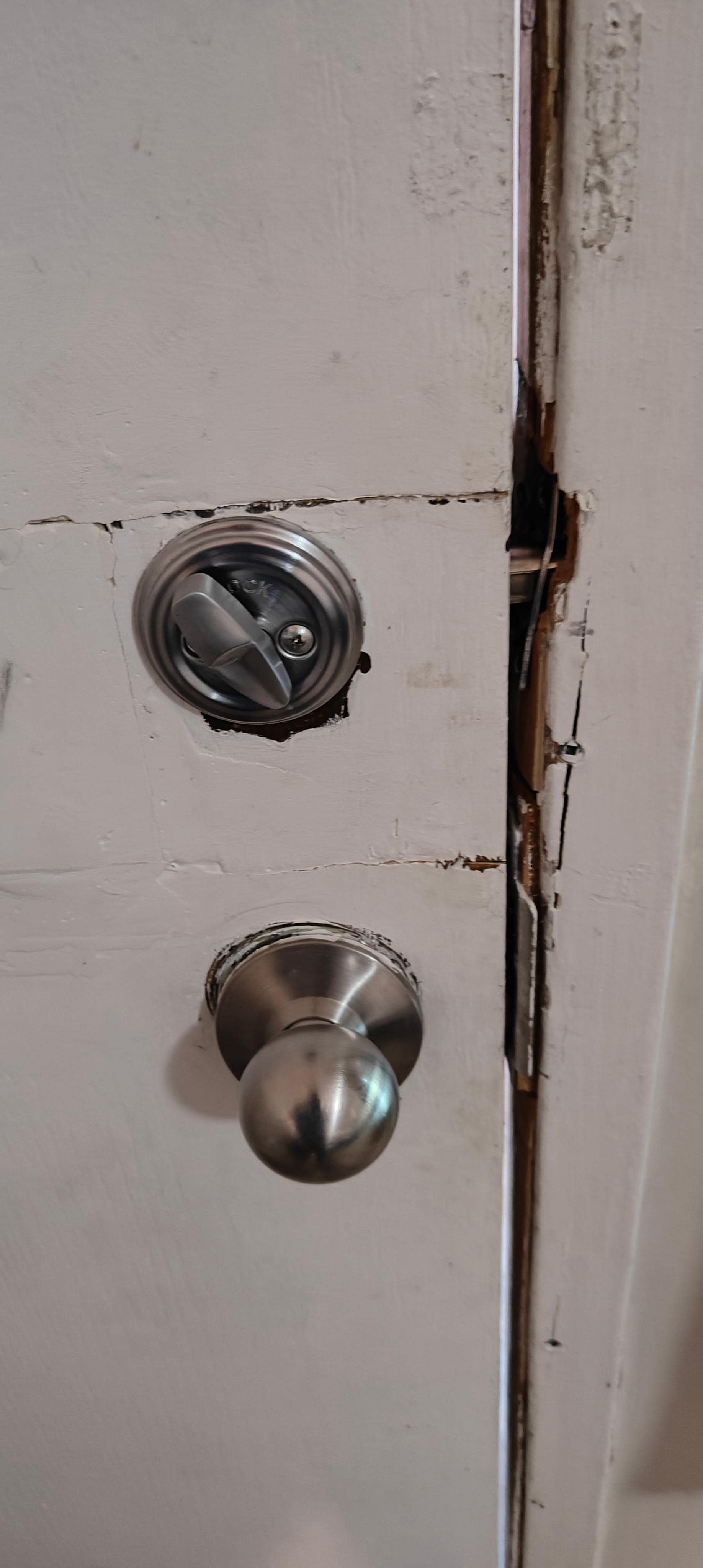 Door had been kicked in at some time and this is the rudimentary repairs. Still locked however.