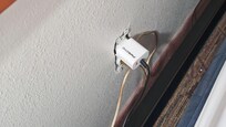 major fire hazard behind one of our Queen beds. A power outlet with no cover on it pushed up against the sheets!