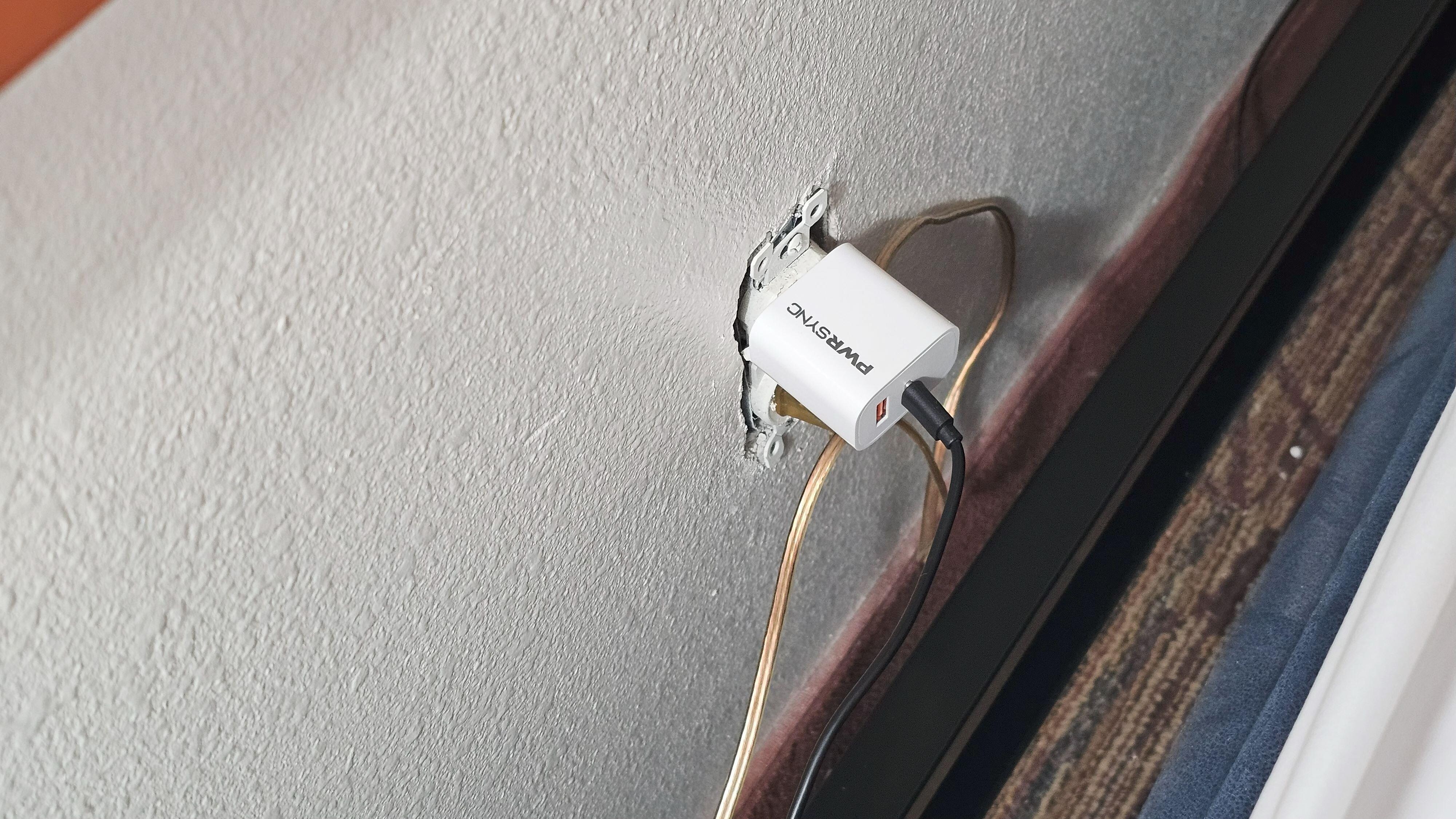 major fire hazard behind one of our Queen beds. A power outlet with no cover on it pushed up against the sheets!